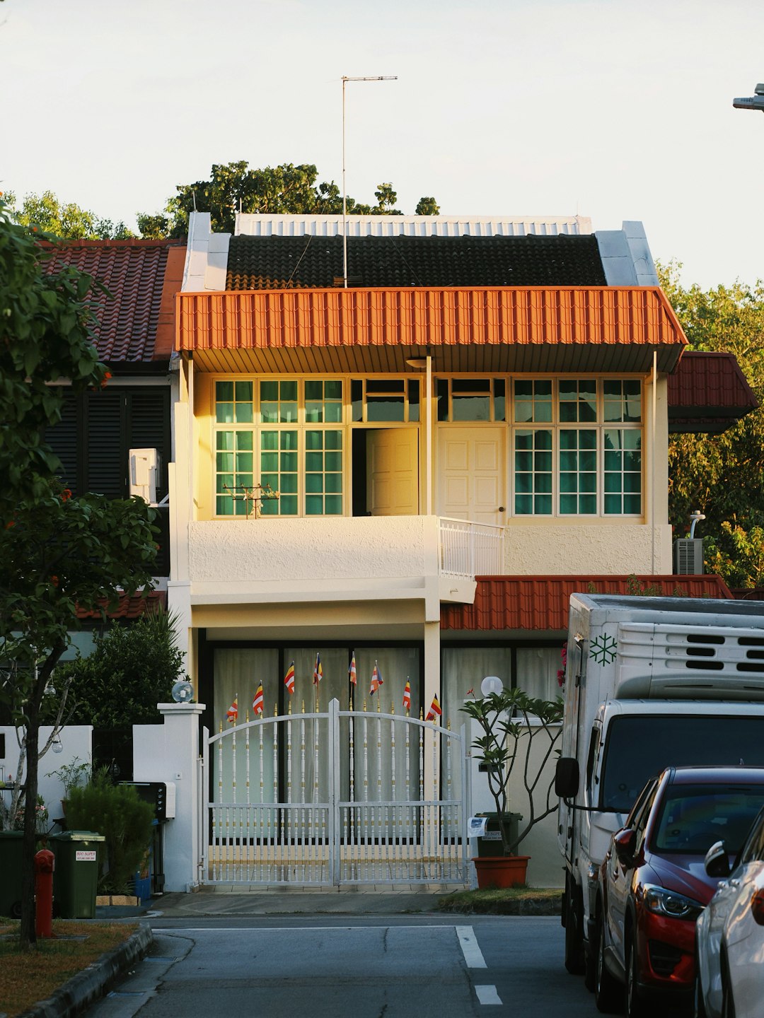 gallery-04 a-two-story-house-with-orange-trim-and-green-windows-dfq5ju-5cly